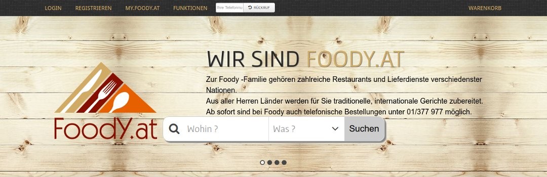 Úvodná stránka FoodY.at s vyhľadávaním reštaurácií na pozadí s imitáciou dreva